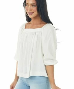 Charlotte Avery Ivory Half Length Bubble Sleeve Blouse With High Low Hemline 11 Charlotte Avery Ivory Half Length Bubble Sleeve Blouse With High Low Hemline