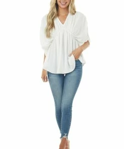 143 Story Tops Ivory V Neck Half Sleeve Babydoll Flowy Blouse