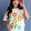 Lotus Fashion Tops Ivory Flower Graphic Drop Shoulder Knit Tee