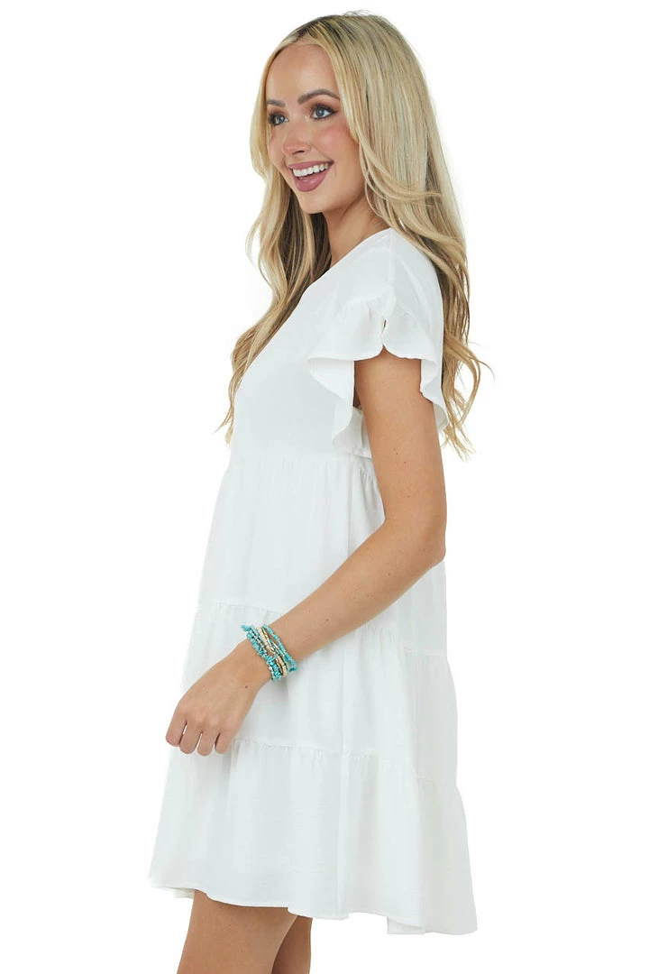 She + Sky Dresses Off White Ruffle Sleeve Tiered Babydoll Dress 6 She + Sky Dresses Off White Ruffle Sleeve Tiered Babydoll Dress