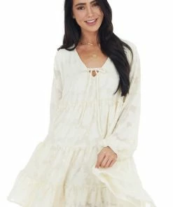 Peach Love Cream Textured Print Tiered Babydoll Dress With Long Sleeves Dresses