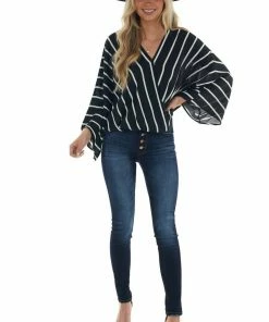 Andree Black And Ivory Striped Surplice Neck Blouse