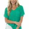 BiBi Tops Jade Short Sleeve Loose Knit Sweater With Front Pocket